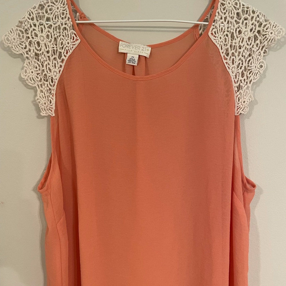 Forever 21 sheer tank top with lace shoulders.